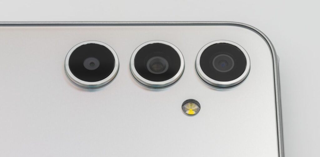 Close-up of a triple rear camera on a modern smartphone