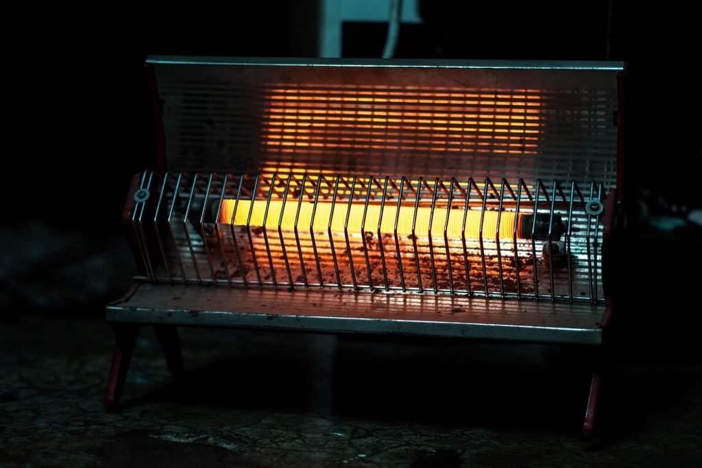 Electric quartz rod heater glowing