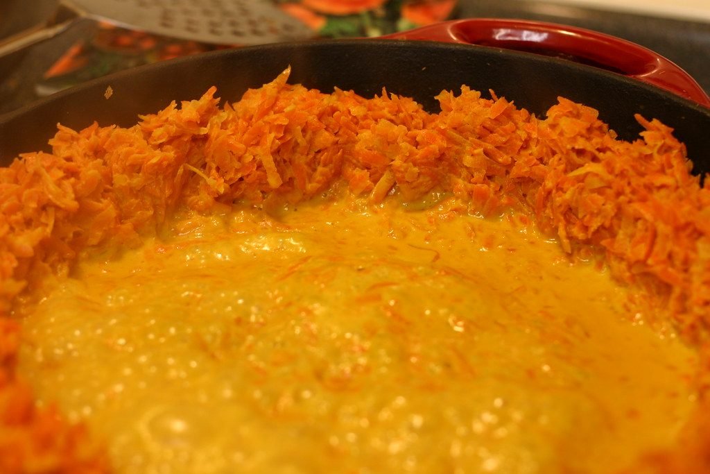 Grated carrots cooking in milk for gajar ka halwa