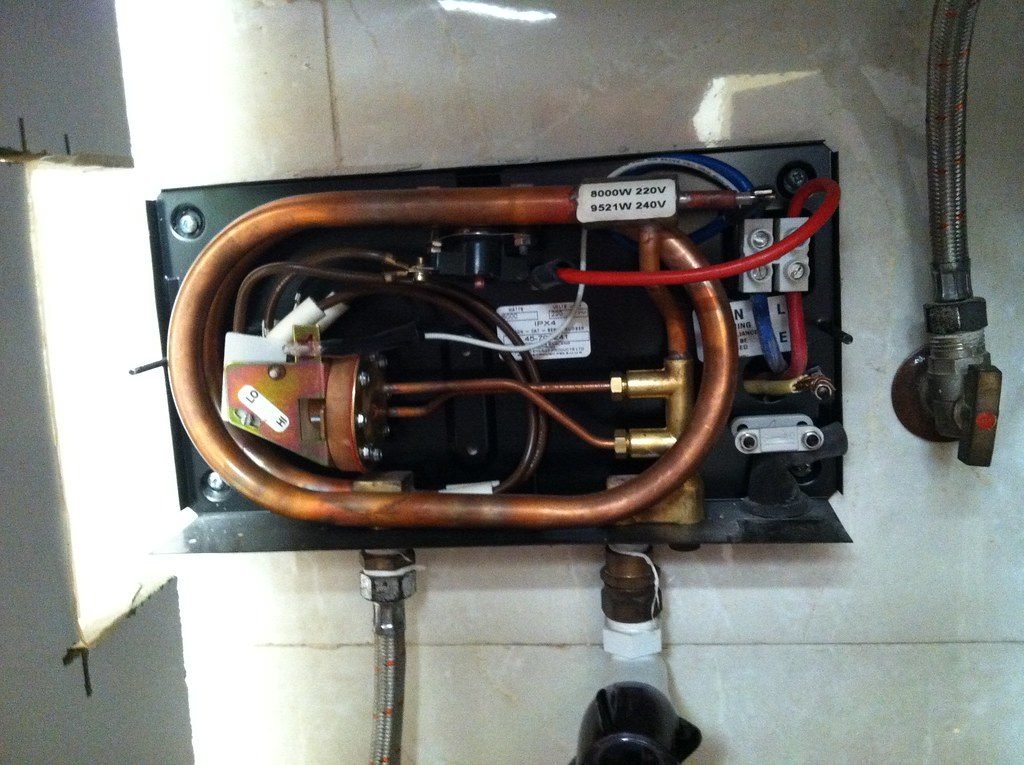 Inside an instant tankless water heater with copper coil