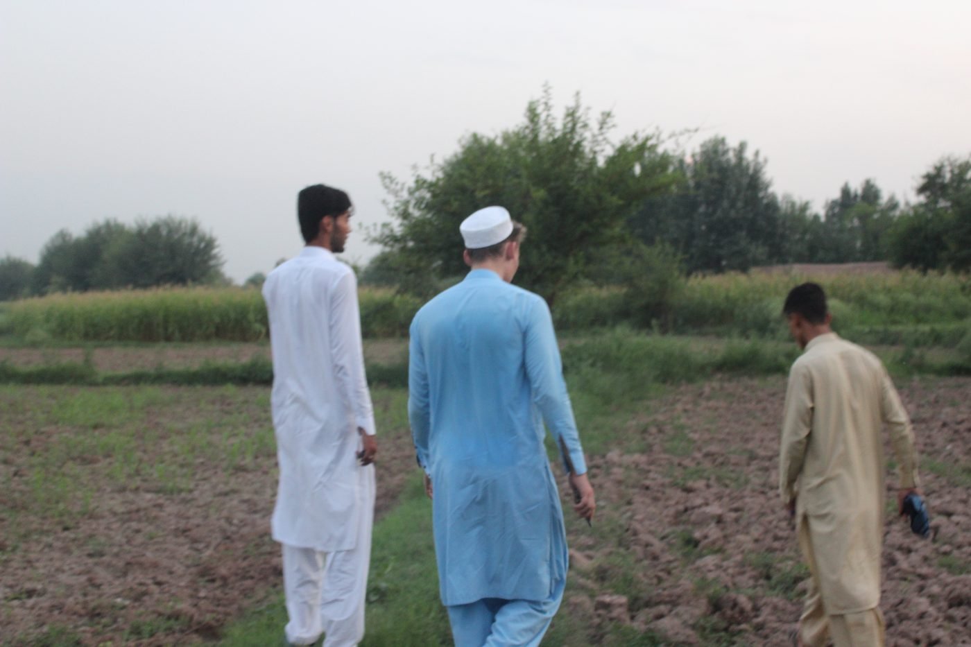 Pakistani men wearing shalwar kameez outdoors