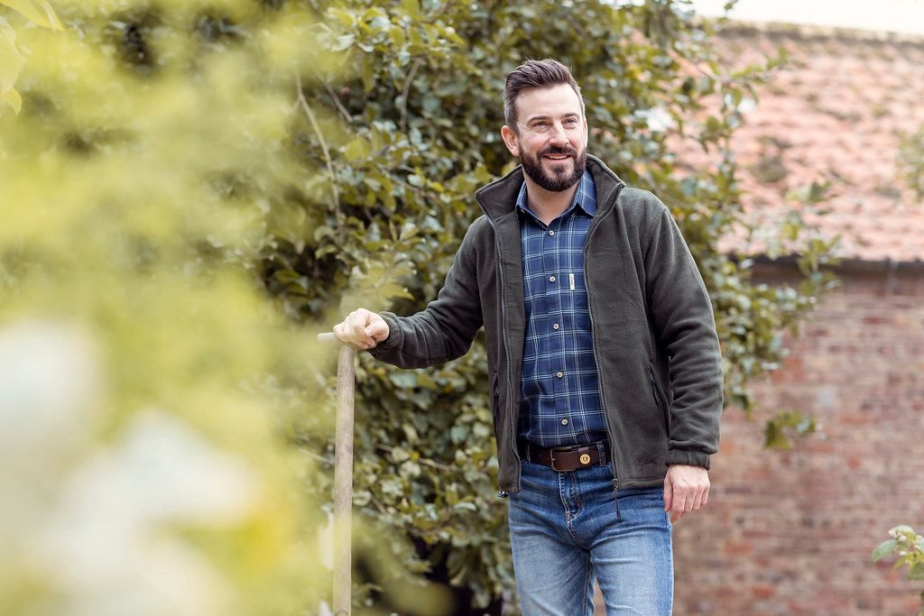 Man in casual winter jacket and checked shirt