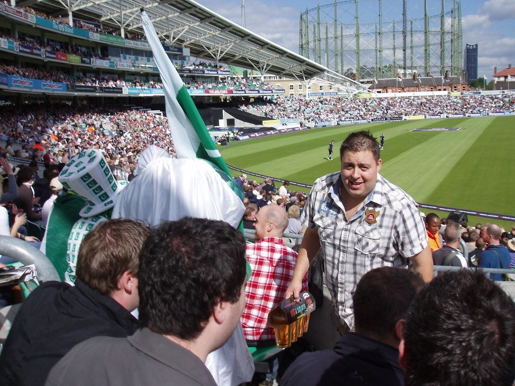 Pakistan cricket fans with green flags in the stands