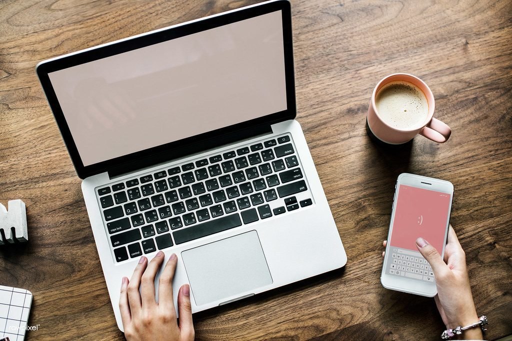 Applying online with laptop and smartphone to renew CNIC