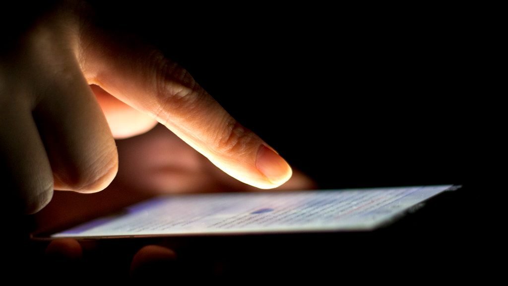 Person using smartphone app to submit online application